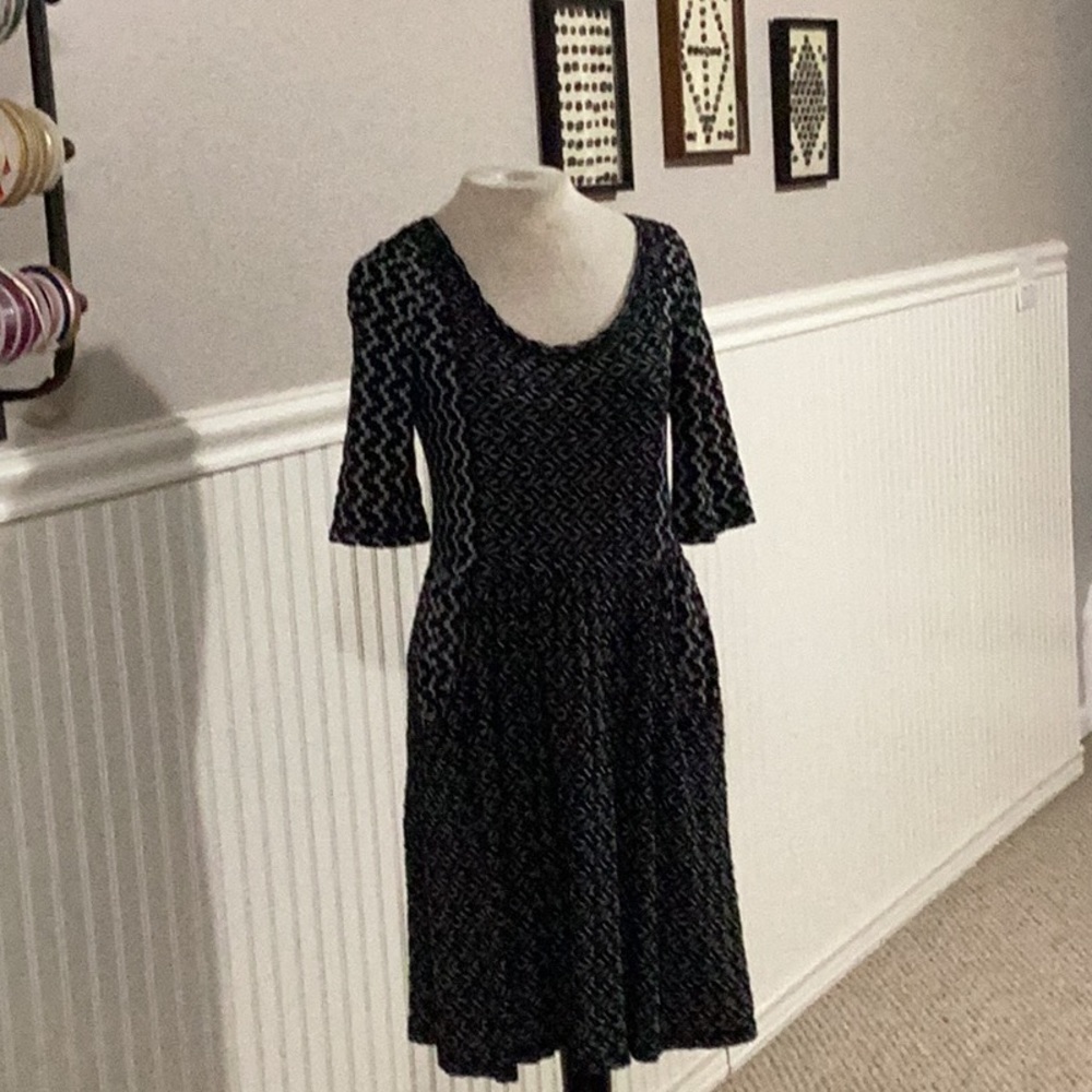 Black and white mixed pattern dress from Anthropology. Scoop neck with pockets